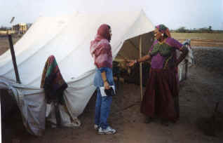 Team member interacting with village team